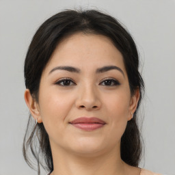 Joyful asian young-adult female with medium  brown hair and brown eyes