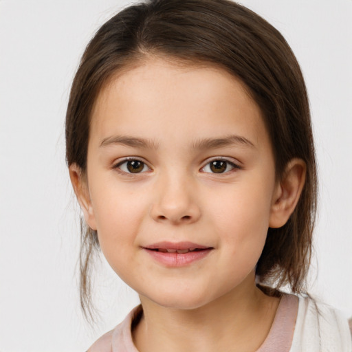 Joyful white child female with medium  brown hair and brown eyes