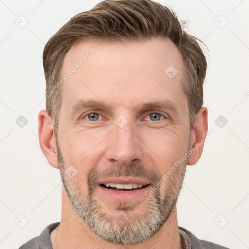 Joyful white adult male with short  brown hair and grey eyes