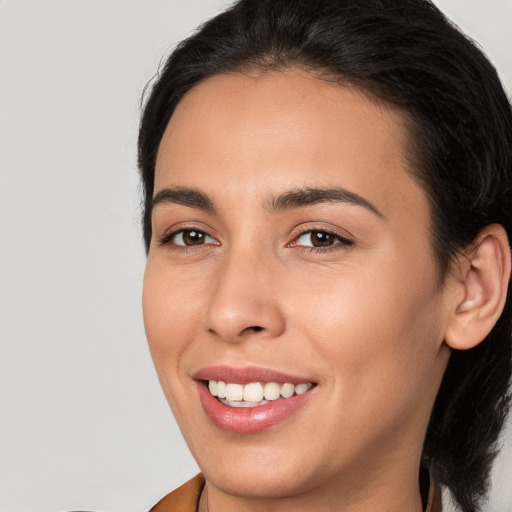 Joyful white young-adult female with medium  brown hair and brown eyes