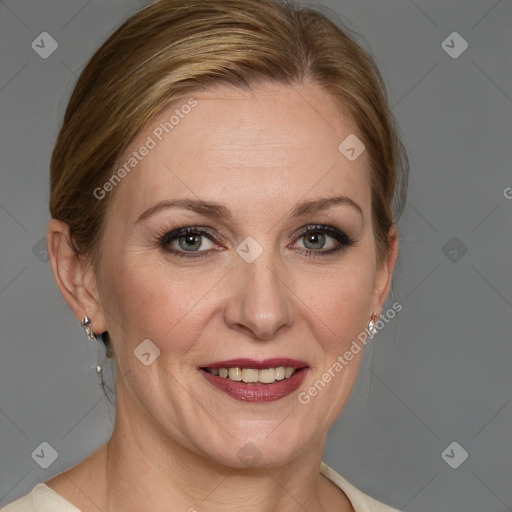 Joyful white adult female with medium  brown hair and blue eyes