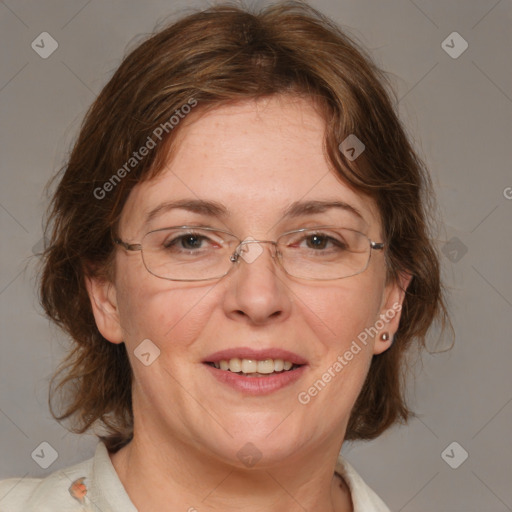 Joyful white adult female with medium  brown hair and blue eyes