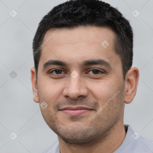 Joyful white young-adult male with short  black hair and brown eyes