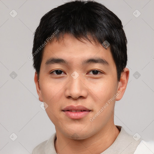 Joyful asian young-adult male with short  black hair and brown eyes