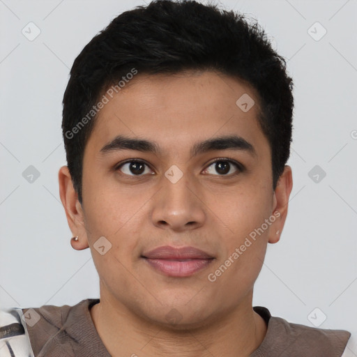 Joyful latino young-adult male with short  brown hair and brown eyes