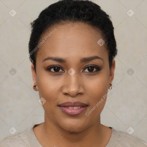 Joyful black young-adult female with short  black hair and brown eyes