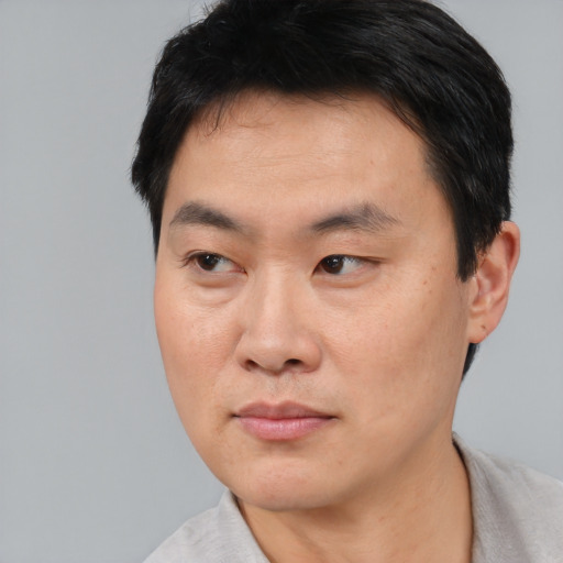 Neutral asian young-adult male with short  black hair and brown eyes