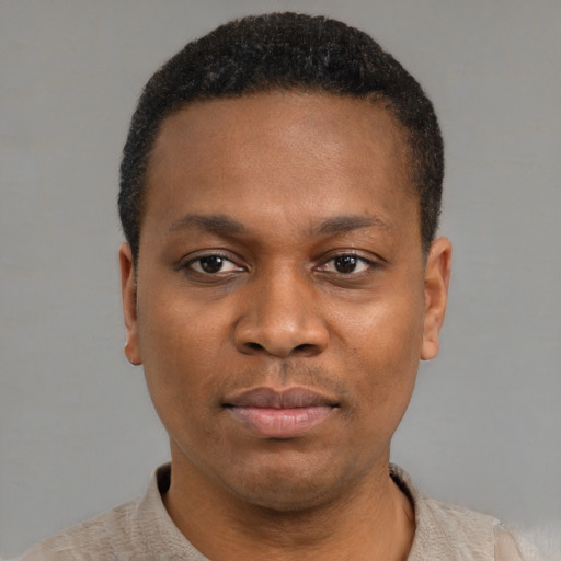 Neutral black young-adult male with short  black hair and brown eyes