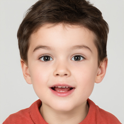 Joyful white child male with short  brown hair and brown eyes