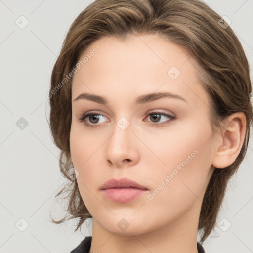 Neutral white young-adult female with long  brown hair and brown eyes