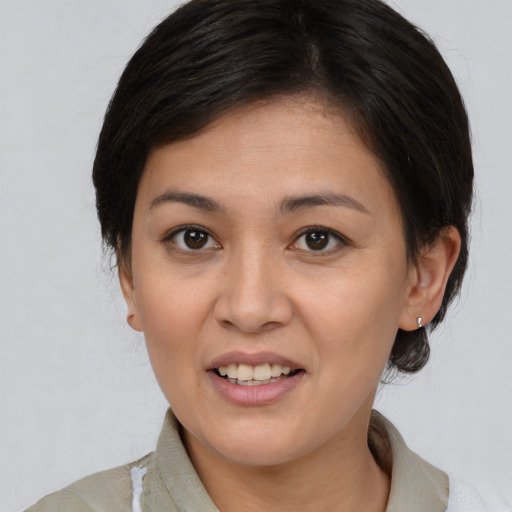 Joyful white young-adult female with medium  brown hair and brown eyes