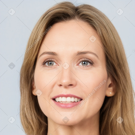 Joyful white young-adult female with long  brown hair and grey eyes