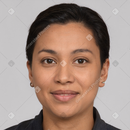 Joyful latino young-adult female with short  brown hair and brown eyes