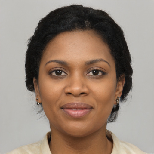 Joyful latino young-adult female with short  black hair and brown eyes