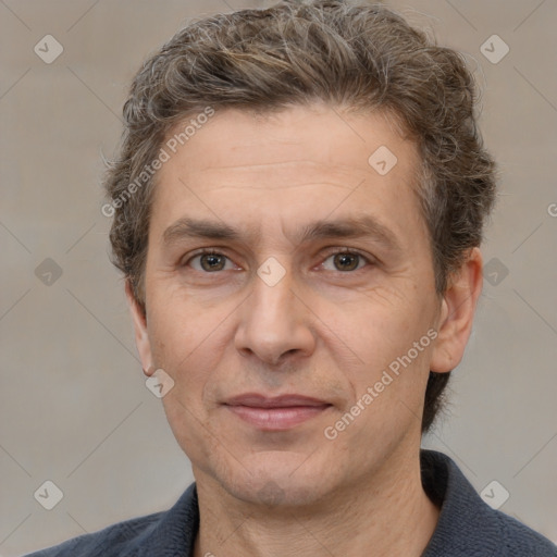 Joyful white adult male with short  brown hair and grey eyes