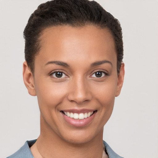 Joyful white young-adult female with short  brown hair and brown eyes