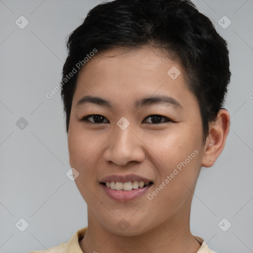 Joyful asian young-adult female with short  brown hair and brown eyes