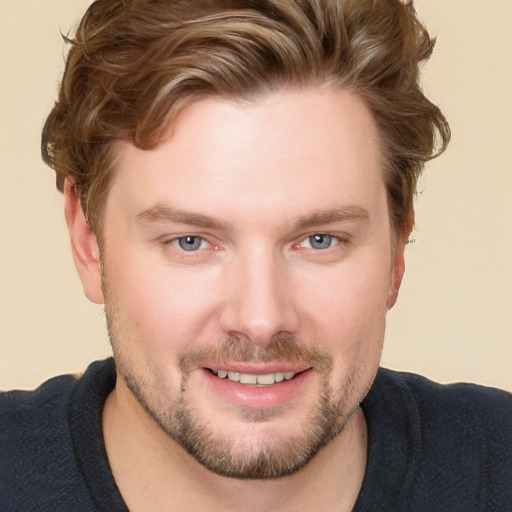 Joyful white young-adult male with short  brown hair and blue eyes