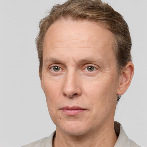 Joyful white adult male with short  brown hair and grey eyes