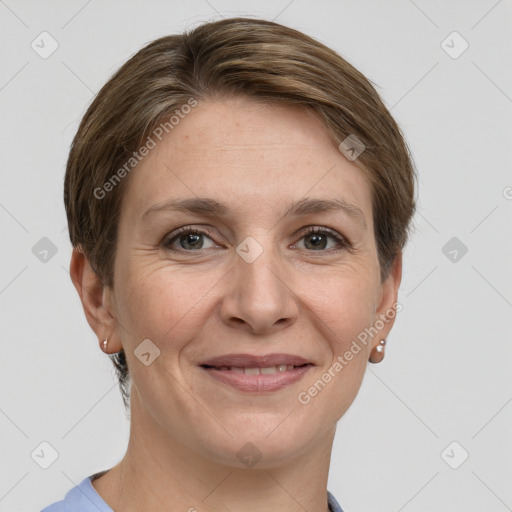 Joyful white adult female with short  brown hair and grey eyes