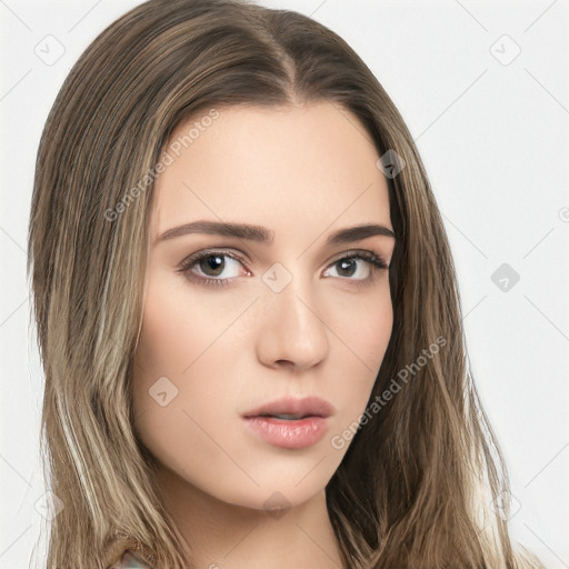 Neutral white young-adult female with long  brown hair and brown eyes