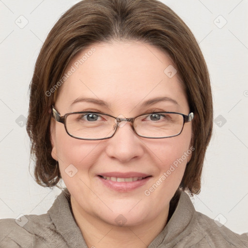 Joyful white adult female with medium  brown hair and blue eyes