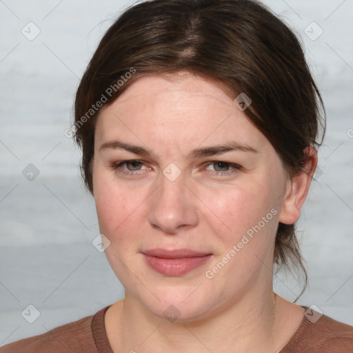 Joyful white young-adult female with medium  brown hair and blue eyes