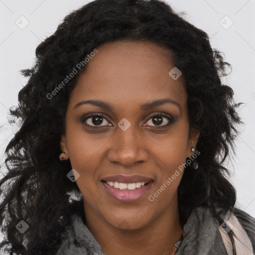 Joyful black young-adult female with long  brown hair and brown eyes