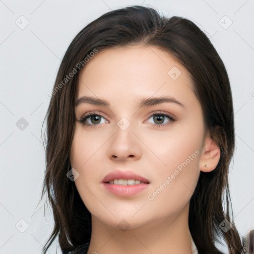 Neutral white young-adult female with long  brown hair and brown eyes