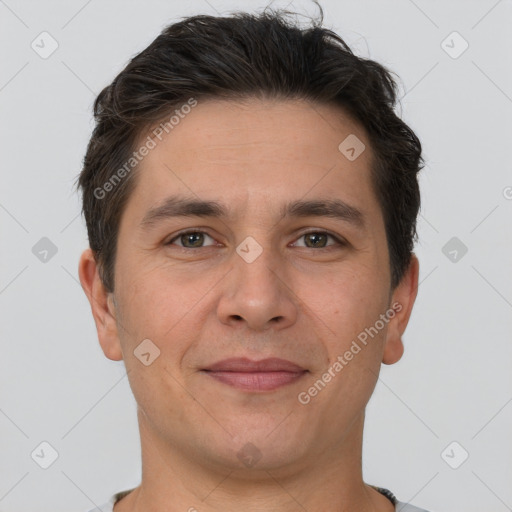 Joyful white adult male with short  brown hair and brown eyes