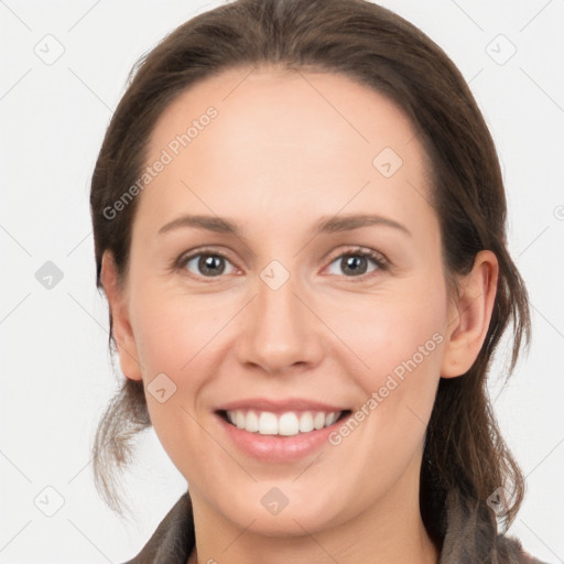 Joyful white young-adult female with medium  brown hair and grey eyes