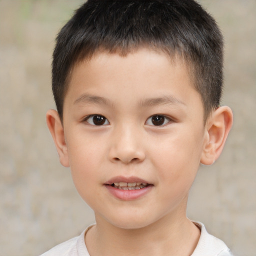 Joyful white child male with short  brown hair and brown eyes