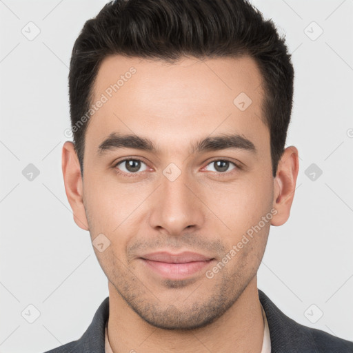 Joyful white young-adult male with short  brown hair and brown eyes