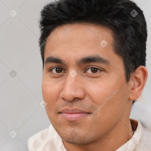 Joyful white young-adult male with short  black hair and brown eyes