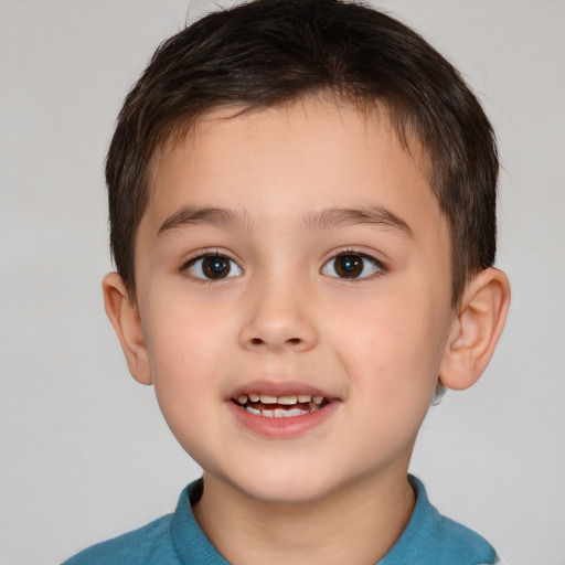 Joyful white child male with short  brown hair and brown eyes