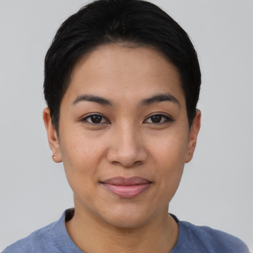 Joyful asian young-adult female with short  black hair and brown eyes