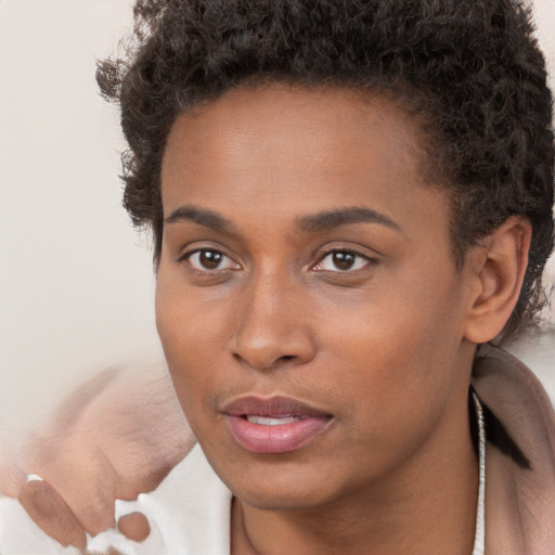 Neutral black young-adult female with short  brown hair and brown eyes