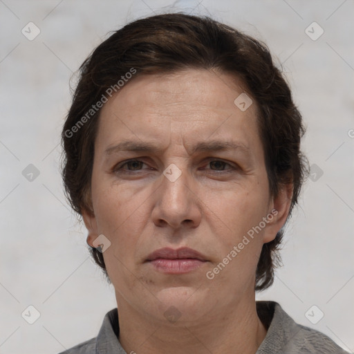 Joyful white adult female with short  brown hair and brown eyes