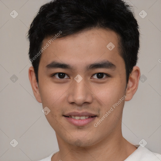 Joyful asian young-adult male with short  brown hair and brown eyes