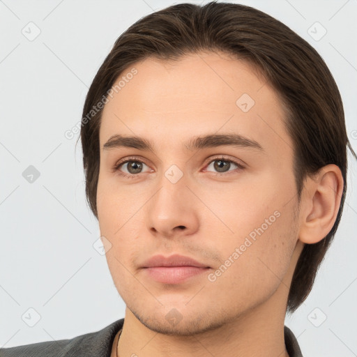 Neutral white young-adult male with short  brown hair and brown eyes