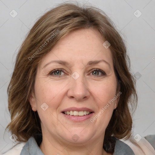 Joyful white adult female with medium  brown hair and grey eyes