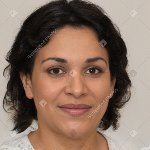 Joyful latino adult female with medium  brown hair and brown eyes