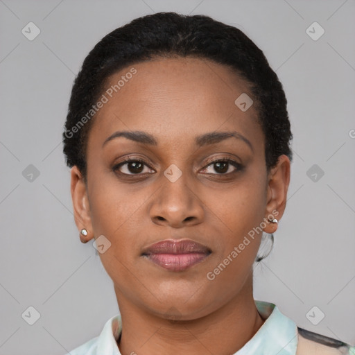 Joyful black young-adult female with short  brown hair and brown eyes
