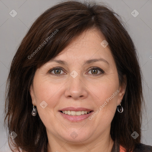 Joyful white adult female with medium  brown hair and brown eyes