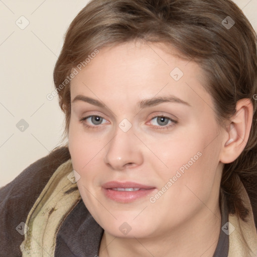 Joyful white young-adult female with medium  brown hair and blue eyes