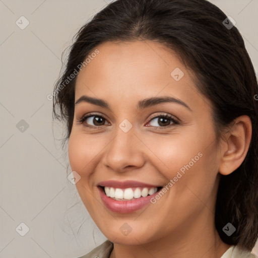 Joyful white young-adult female with medium  brown hair and brown eyes