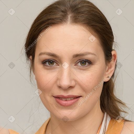 Joyful white young-adult female with medium  brown hair and blue eyes