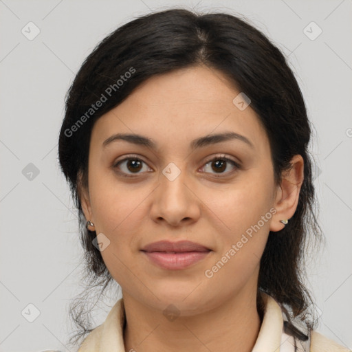 Joyful latino young-adult female with medium  brown hair and brown eyes