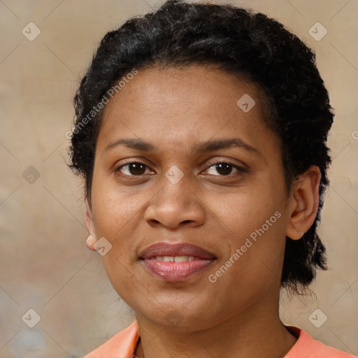 Joyful latino adult female with short  brown hair and brown eyes