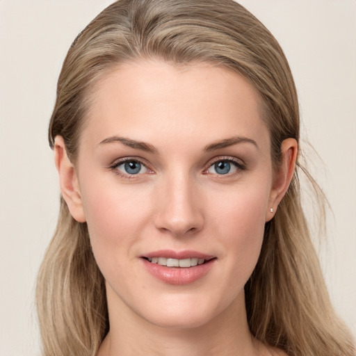 Joyful white young-adult female with long  brown hair and grey eyes